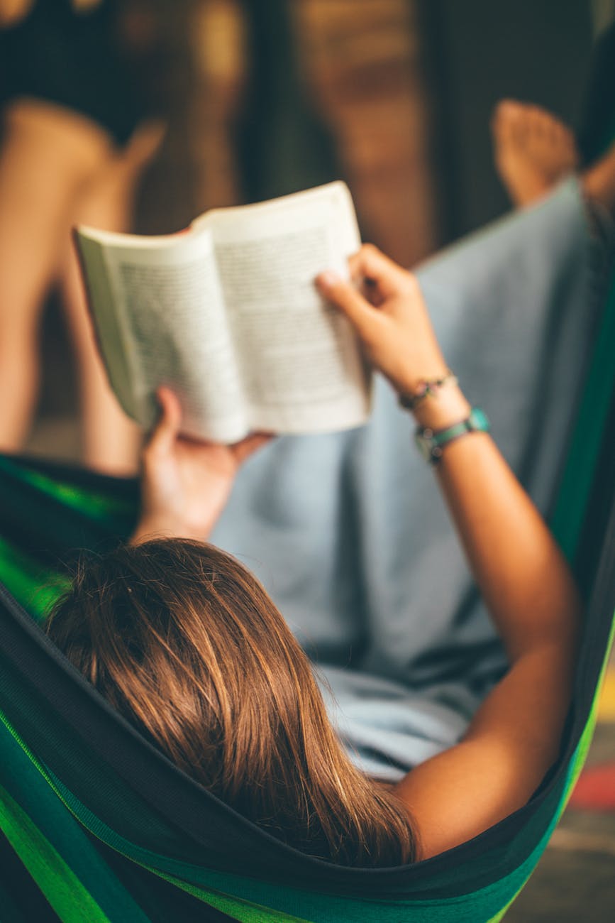 woman on hammock reading book